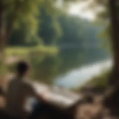 Person engrossed in a book by a tranquil lakeside