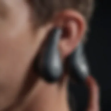 Close-up view of a Powerbeats Pro earbud with eartips demonstrating sound isolation features.