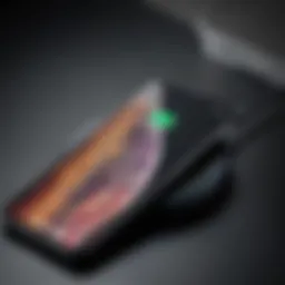 Close-up view of an iPhone being charged wirelessly with an automatic charger.